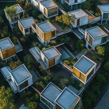 Team defining project requirements around a laptop